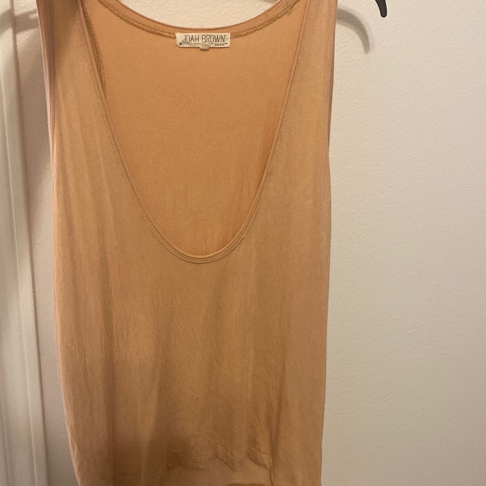 I see it Tan my daughter sees it orange